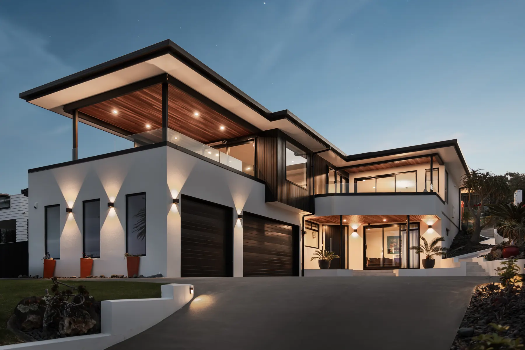A contemporary coastal home photographed at blue hour