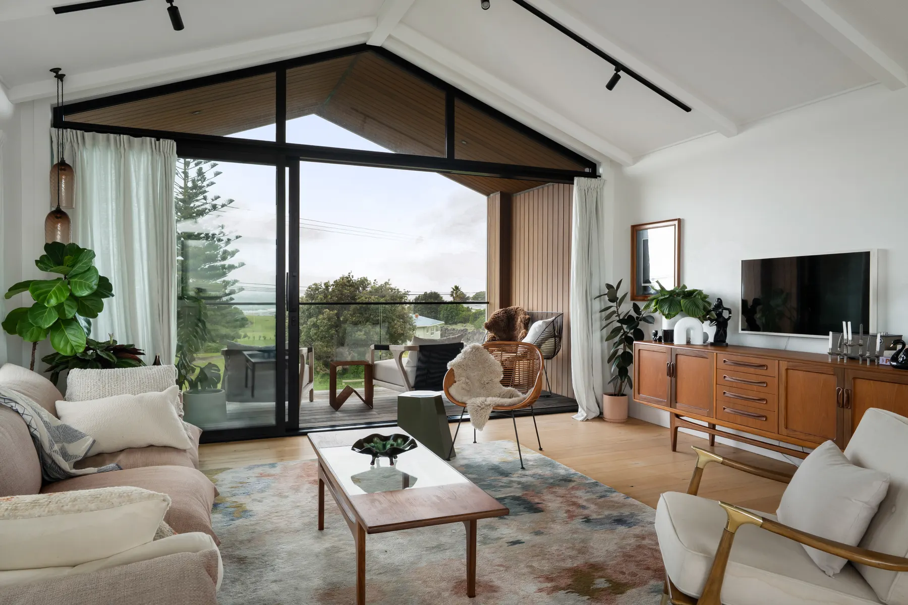 A bright, carefully photographed coastal living room