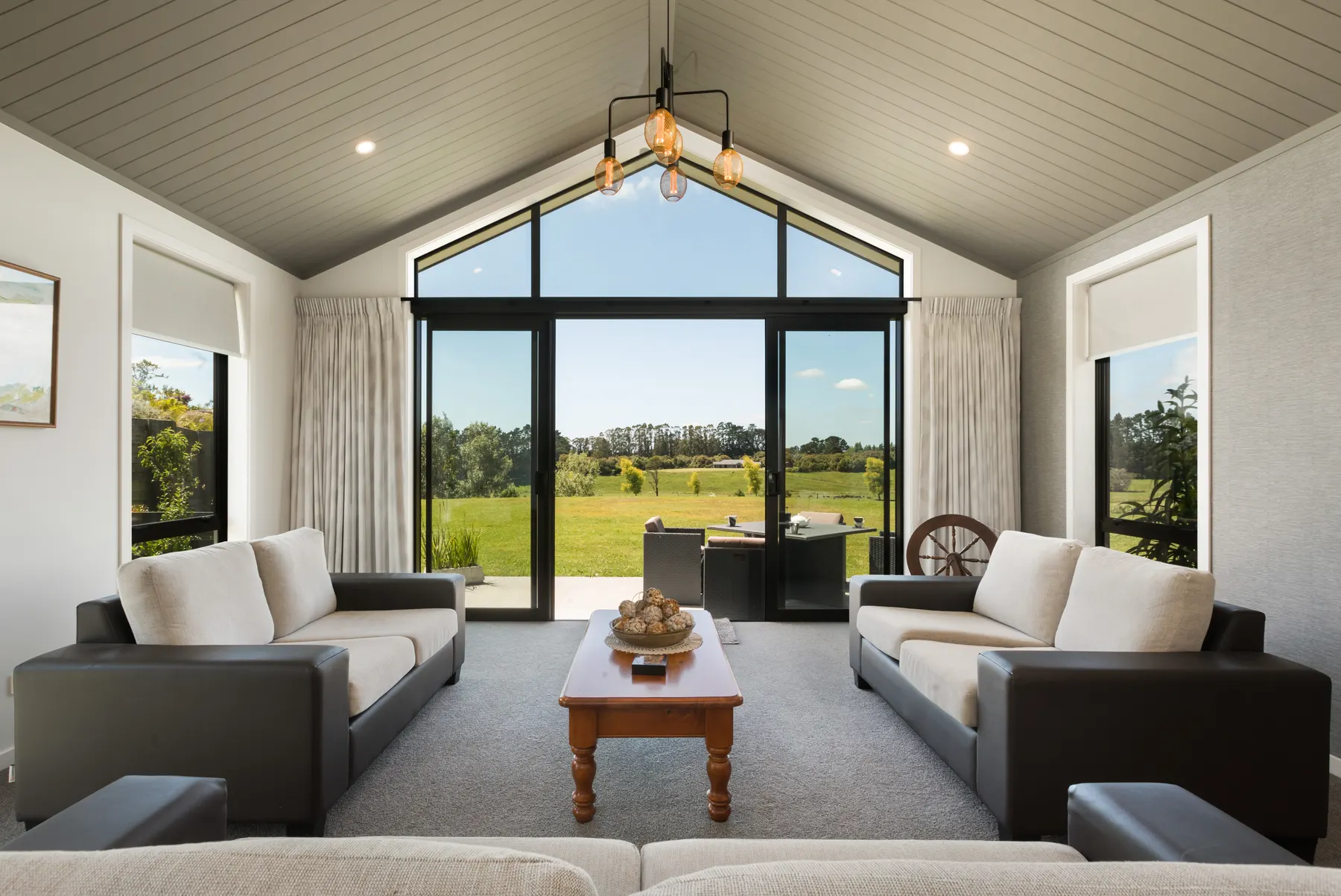 A high-ceiling lifestyle home photographed with its rural outlook
