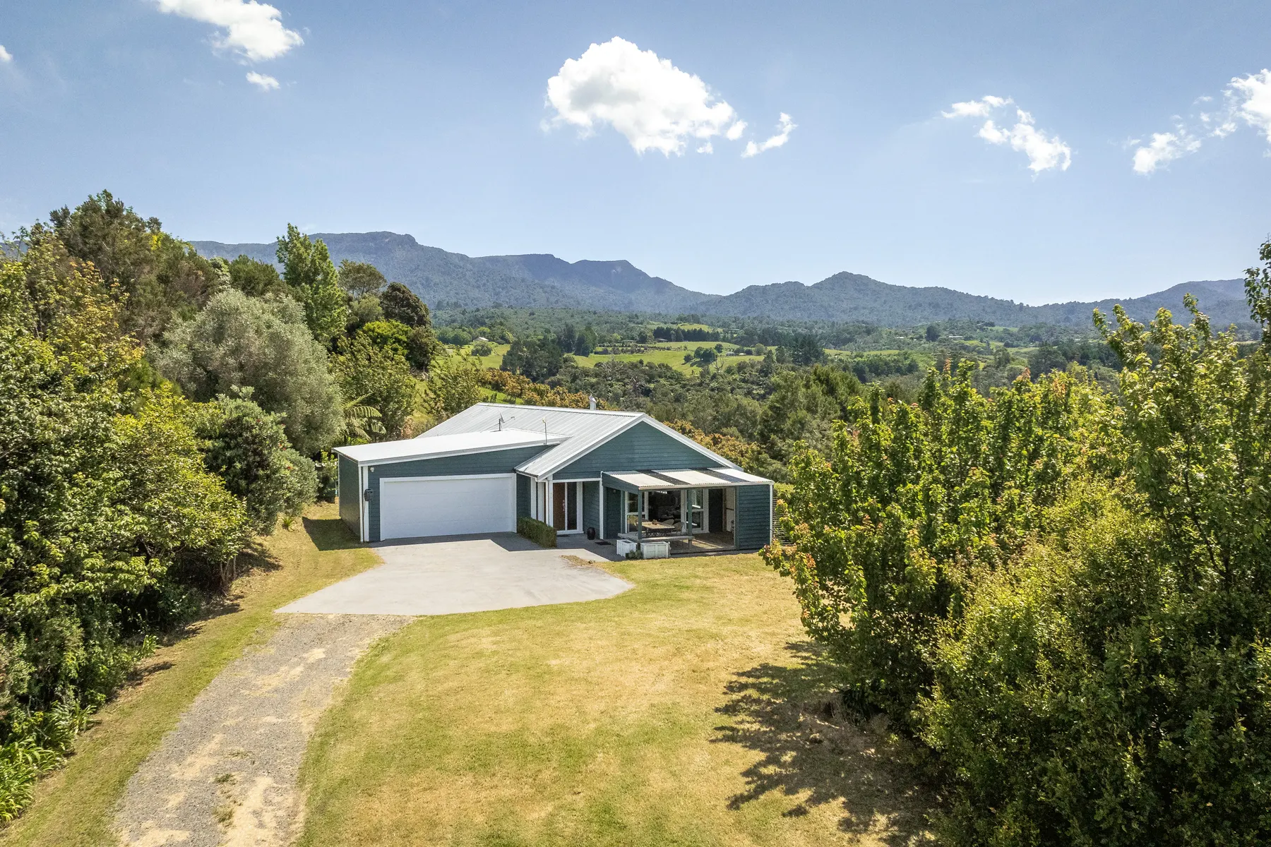 A lifestyle property and surrounding landscape photographed by drone